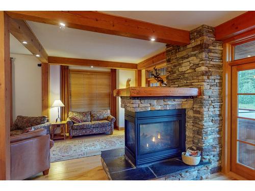 6 - 1595 Whitetooth Trail, Golden, BC - Indoor Photo Showing Living Room With Fireplace