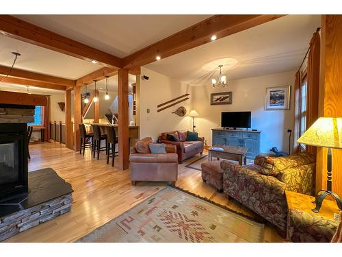 6 - 1595 Whitetooth Trail, Golden, BC - Indoor Photo Showing Living Room With Fireplace