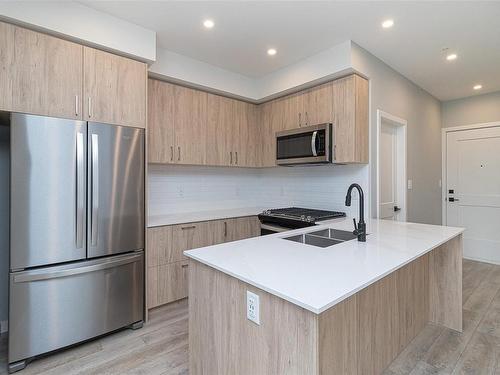 304-654 Granderson Rd, Langford, BC - Indoor Photo Showing Kitchen With Stainless Steel Kitchen With Double Sink