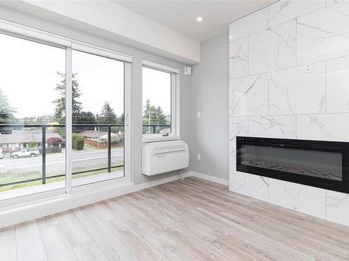 304-654 Granderson Rd, Langford, BC - Indoor Photo Showing Other Room With Fireplace