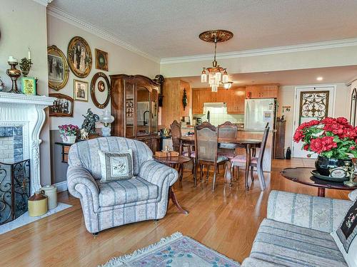 Dining room - 118-1920 Rue Adoncour, Longueuil (Le Vieux-Longueuil), QC - Indoor Photo Showing Living Room With Fireplace