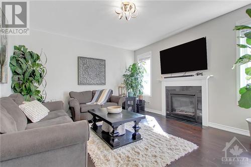 54 Moonbeam Street, Ottawa, ON - Indoor Photo Showing Living Room With Fireplace