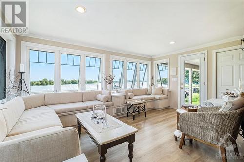 Main floor family room with bar and amazing river view. - 9 Shoreline Road, Johnstown, ON - Indoor Photo Showing Living Room