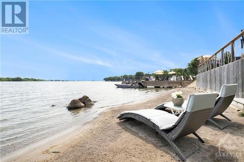 Over 100' of sandy beachfront. - 9 Shoreline Road, Johnstown, ON - Outdoor With Body Of Water