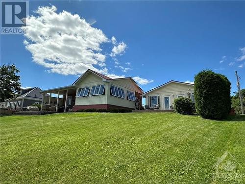 View from the river looking at house and secondary residence. - 9 Shoreline Road, Johnstown, ON - Outdoor