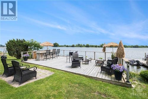 Deck overlooking the sandy, gradual beach - 9 Shoreline Road, Johnstown, ON - Outdoor With Body Of Water With Deck Patio Veranda