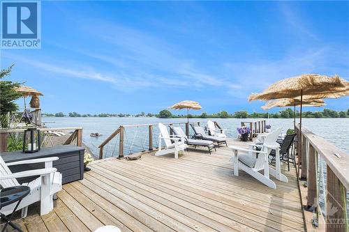 Sandy beachfront in Cleveland Bay along the St Lawrence. - 9 Shoreline Road, Johnstown, ON - Outdoor With Body Of Water With Deck Patio Veranda