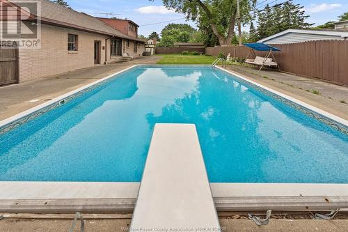 4015 Dougall Avenue, Windsor, ON - Outdoor With In Ground Pool With Backyard