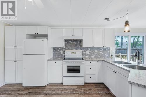 6 Carruthers Street S, Wasaga Beach, ON - Indoor Photo Showing Kitchen With Double Sink