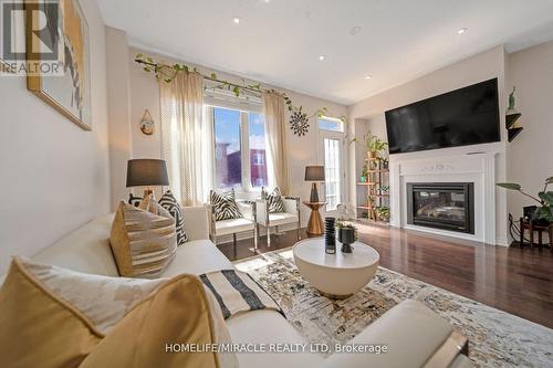 762 Sugden Terrace W, Milton, ON - Indoor Photo Showing Living Room With Fireplace