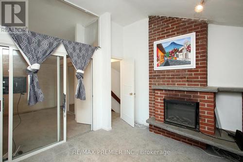 24 Panmure Crescent E, Toronto, ON - Indoor Photo Showing Living Room With Fireplace