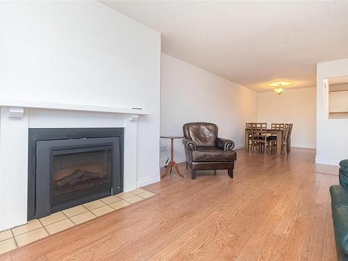 403-1560 Hillside Ave, Victoria, BC - Indoor Photo Showing Living Room With Fireplace