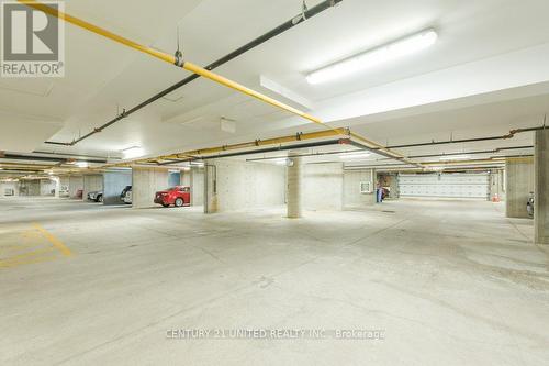 209 - 869 Clonsilla Avenue, Peterborough, ON - Indoor Photo Showing Garage