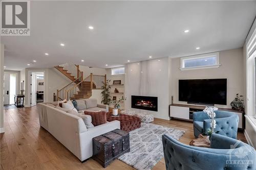 64 St Claire Avenue, Ottawa, ON - Indoor Photo Showing Living Room With Fireplace