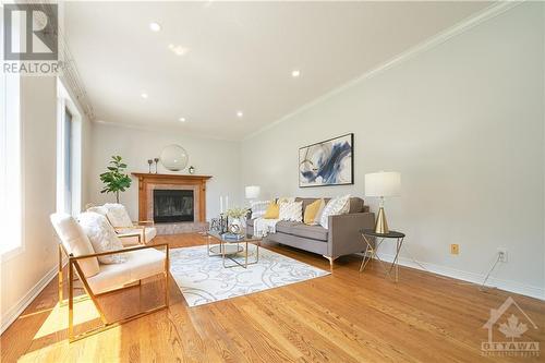 Bright family room with fireplace - 42 Marchbrook Circle, Kanata, ON - Indoor Photo Showing Living Room With Fireplace