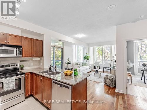 207 - 3504 Hurontario Street, Mississauga, ON - Indoor Photo Showing Kitchen With Stainless Steel Kitchen With Double Sink