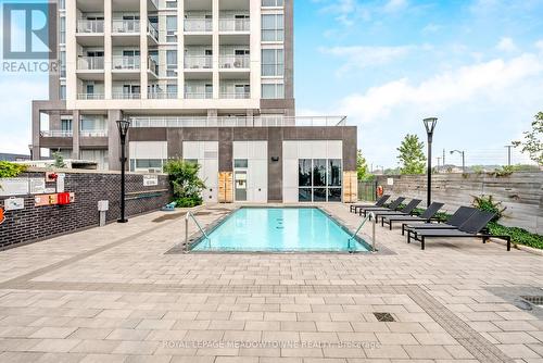 207 - 1050 Main Street E, Milton, ON - Outdoor With In Ground Pool