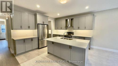 109 Bearberry Road, Springwater, ON - Indoor Photo Showing Kitchen With Double Sink