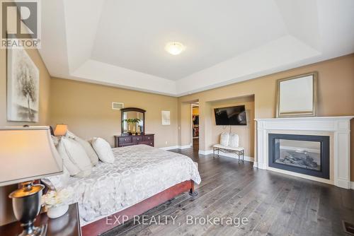 57 Hogan Court, King, ON - Indoor Photo Showing Bedroom With Fireplace