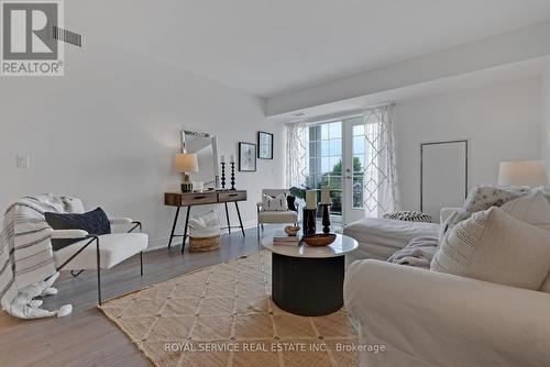 303 - 21 Brookhouse Drive, Clarington, ON - Indoor Photo Showing Living Room