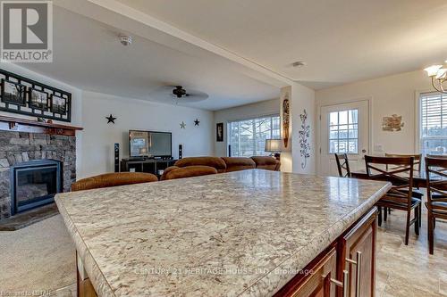 Imported from itso - A17 - 4838 Switzer Drive, Southwest Middlesex, ON - Indoor Photo Showing Dining Room With Fireplace