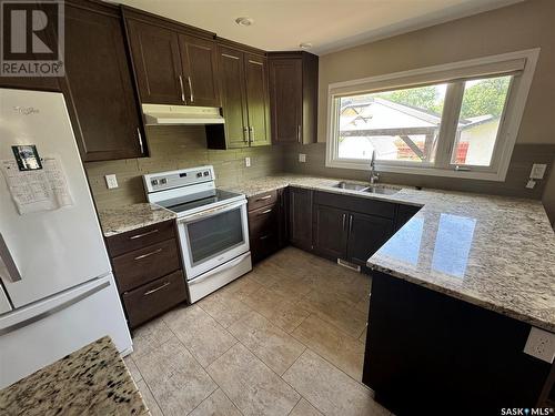 108 Mackie Crescent, Saskatoon, SK - Indoor Photo Showing Kitchen With Double Sink