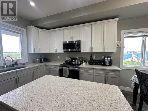 8203 79A Street, Fort St. John, BC - Indoor Photo Showing Kitchen With Double Sink
