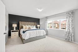 Large primary bedroom with beautiful windows! - 