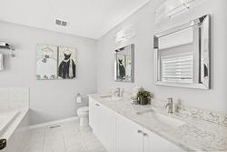 Stunning ensuite with double sink marble top vaninty and soaker tub! - 