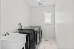 Convenient upper laundry with laundry tub and storage closet! - 