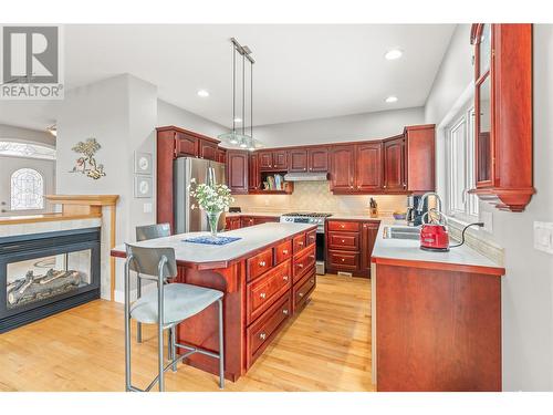 14225 Oyama Road, Lake Country, BC - Indoor Photo Showing Kitchen With Fireplace With Double Sink