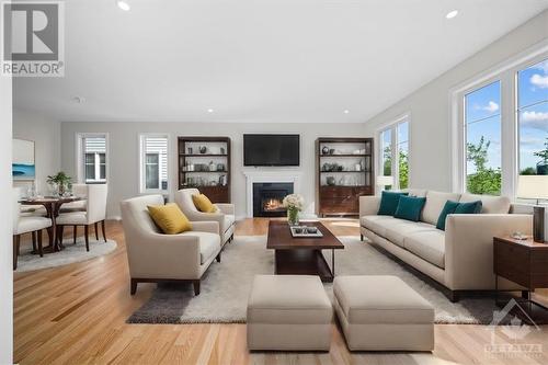 Virtually staged - 91 Hackamore Crescent, Richmond, ON - Indoor Photo Showing Living Room With Fireplace