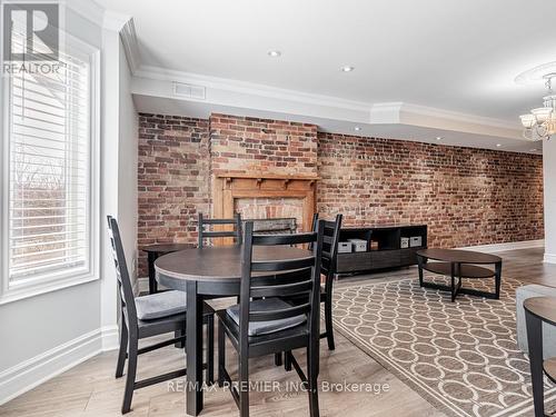 10 St Annes Road, Toronto (Little Portugal), ON - Indoor Photo Showing Dining Room With Fireplace