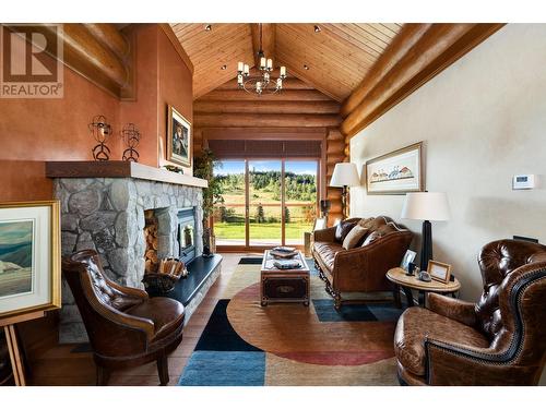 5957 Thorsteinson Road, 103 Mile House, BC - Indoor Photo Showing Living Room With Fireplace