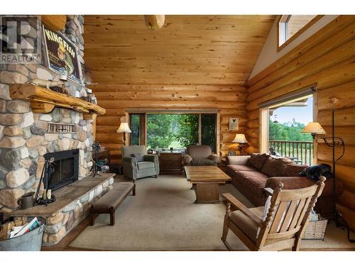 5957 Thorsteinson Road, 103 Mile House, BC - Indoor Photo Showing Living Room With Fireplace