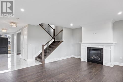 7355 Garnet, Mcgregor, ON - Indoor Photo Showing Living Room With Fireplace