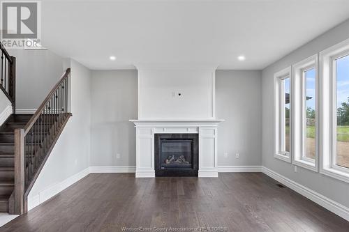 7355 Garnet, Mcgregor, ON - Indoor Photo Showing Living Room With Fireplace