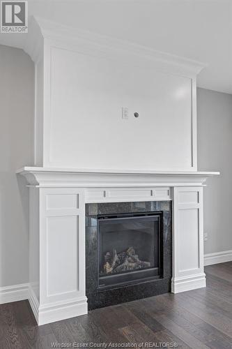 7355 Garnet, Mcgregor, ON - Indoor Photo Showing Living Room With Fireplace