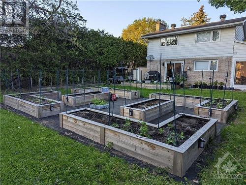 Backyard with landscaped garden - the garden beds are removable - 2114 Balharrie Avenue, Ottawa, ON - Outdoor With Deck Patio Veranda