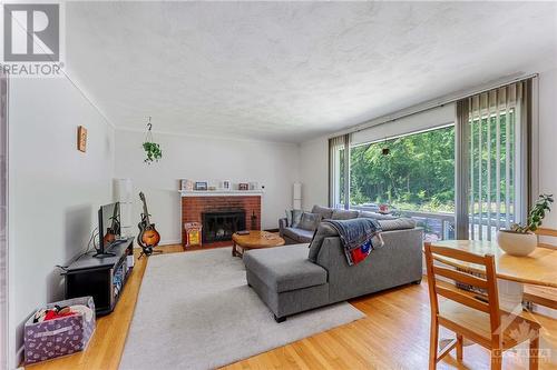 933 Alpine Avenue, Ottawa, ON - Indoor Photo Showing Living Room With Fireplace