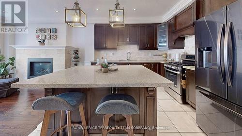 100 Falstaff Avenue, Toronto, ON - Indoor Photo Showing Kitchen With Fireplace With Upgraded Kitchen