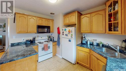 94 Portland Crescent, Regina, SK - Indoor Photo Showing Kitchen With Double Sink