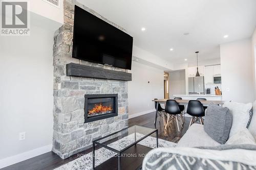 107 - 11 Beausoleil Lane, Blue Mountains, ON - Indoor Photo Showing Living Room With Fireplace