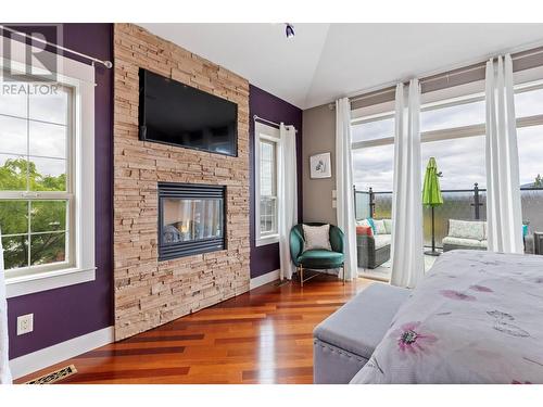 12852 Apex Drive, Lake Country, BC - Indoor Photo Showing Bedroom With Fireplace