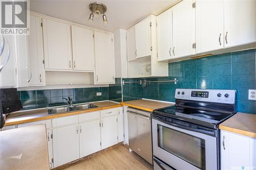 215 6Th Street E, Prince Albert, SK - Indoor Photo Showing Kitchen With Double Sink