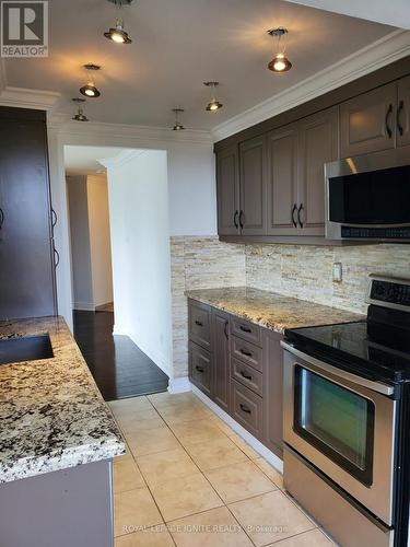 324 - 11753 Sheppard Avenue E, Toronto, ON - Indoor Photo Showing Kitchen With Upgraded Kitchen