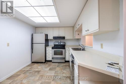 204 - 1 Heritage Way, Kawartha Lakes, ON - Indoor Photo Showing Kitchen With Double Sink