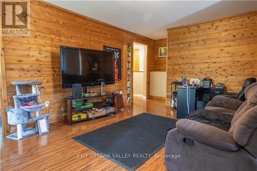 25805 Highway 60, South Algonquin, ON - Indoor Photo Showing Living Room With Fireplace