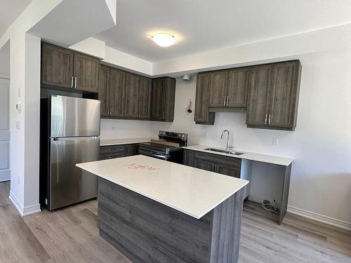 35-448 Blackburn Dr, Brantford, ON - Indoor Photo Showing Kitchen With Stainless Steel Kitchen With Double Sink