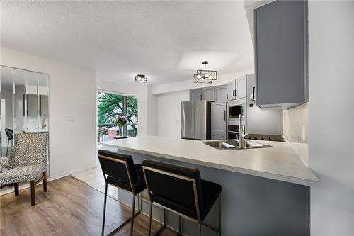 240 Quigley Road|Unit #204, Hamilton, ON - Indoor Photo Showing Kitchen With Double Sink